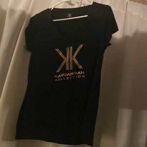 Kim kardashian black short sleeve top.. good condition